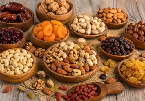Fresh assorted healthy nuts and dried fruits arranged in a wooden bowl for daily nutrition