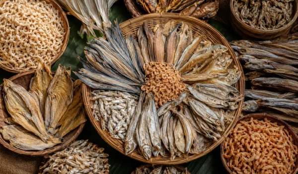 Assorted dry fish (shutki) displayed on a clean plate with natural lighting